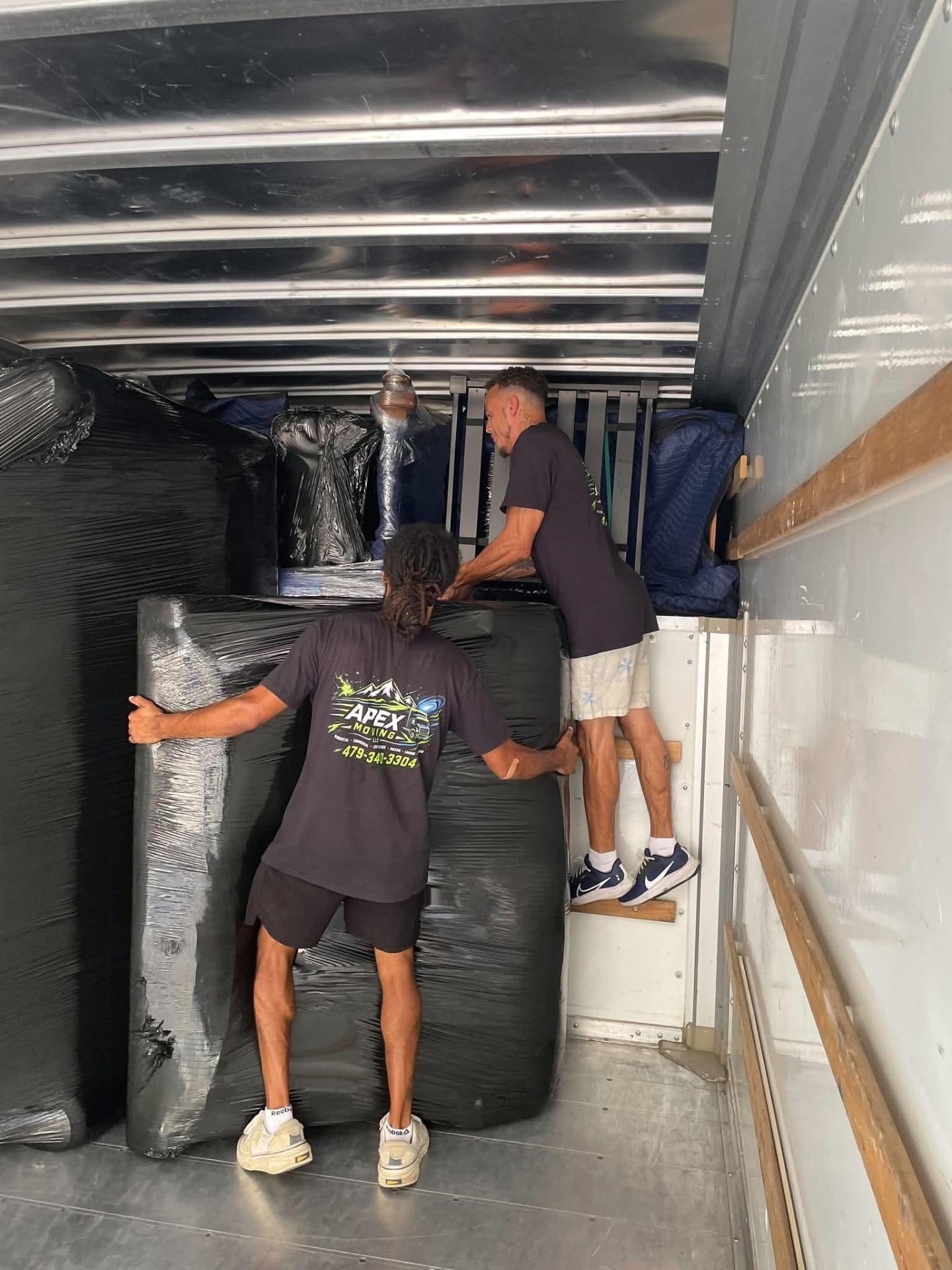 Movers carrying furniture safely